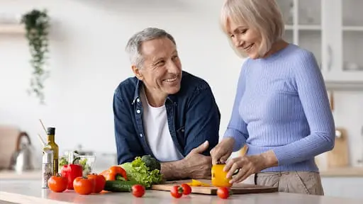 older couple making healthy snacks for senior at home older couple making healthy snacks for senior at home