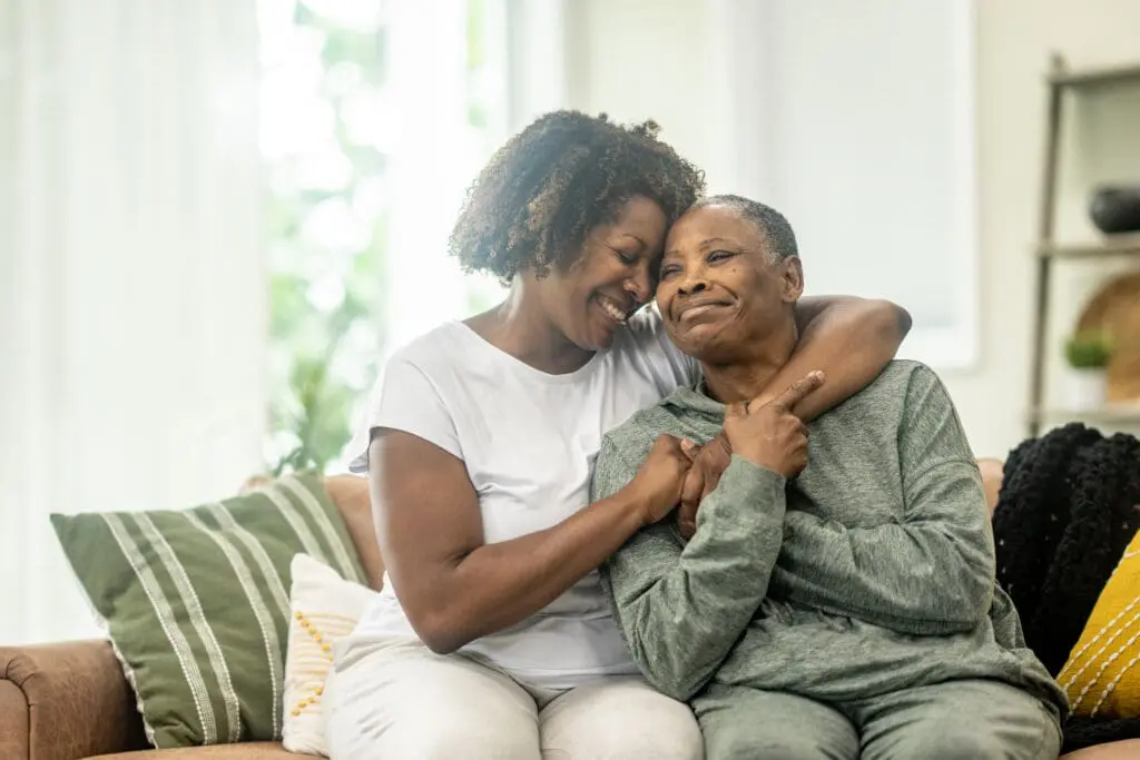 woman hugging her senior mother after discussing signs it's time for Independent Living at Canterbury Woods Gates Circle.