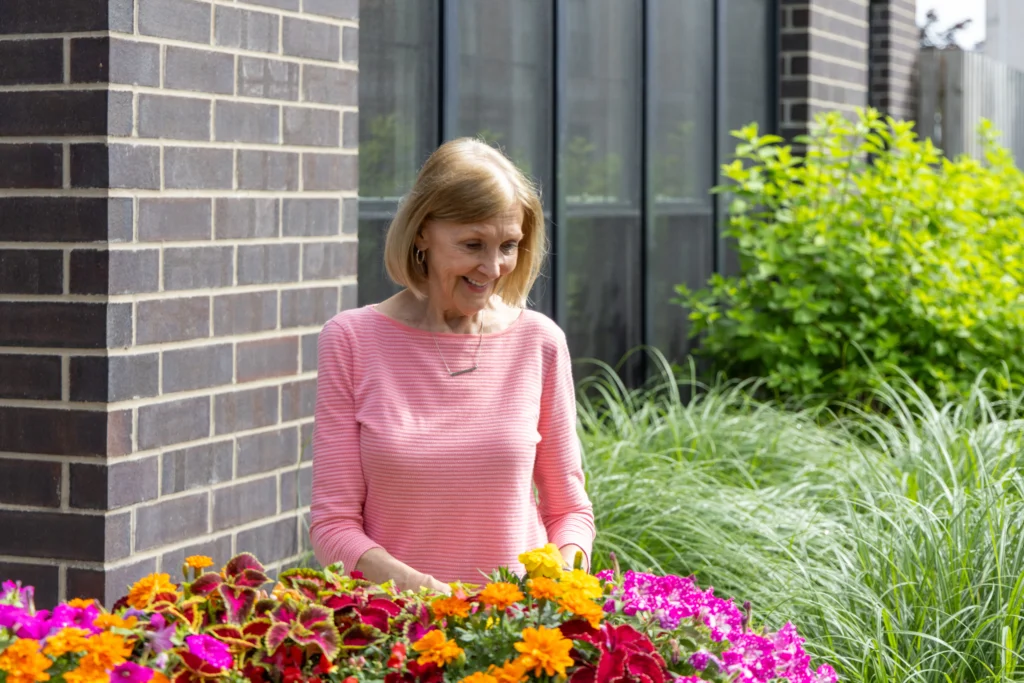 senior woman gardening at Gates Circle 